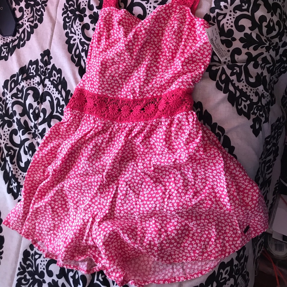 Pink, open back Romper.